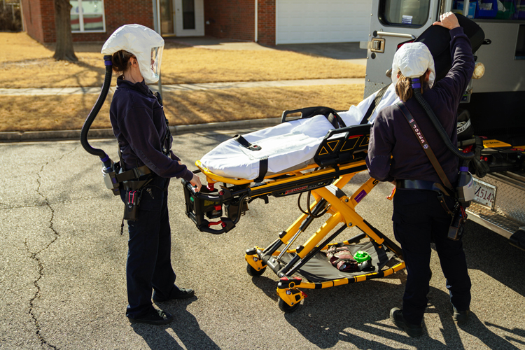EMSSTAT paramedics in protective hoods.