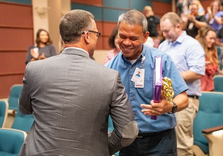 Eugene accepting an award